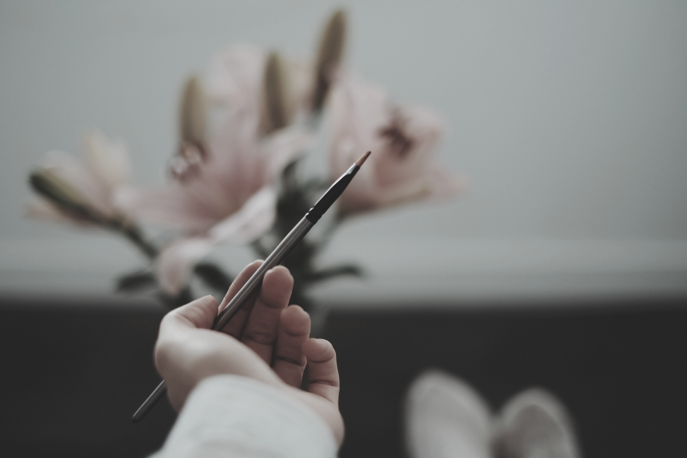 Woman holding paint brush